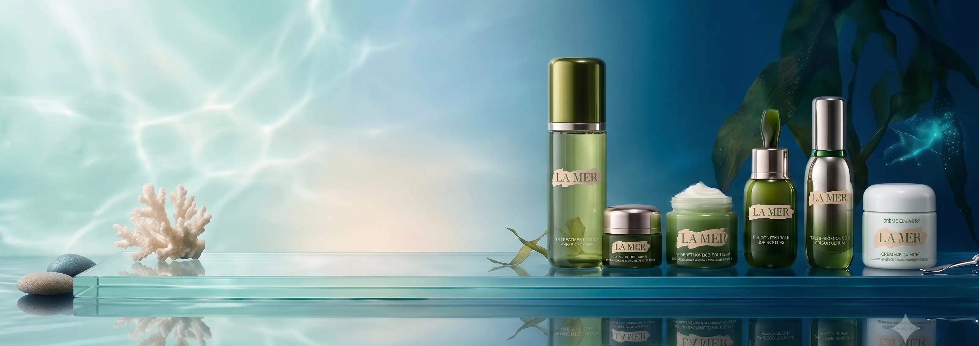 A lineup of La Mer skincare products including a tall serum bottle, a small jar, a dropper bottle, and a cream jar, styled on a reflective blue surface with an underwater ocean theme background.